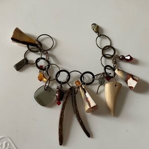 Charm bracelet with Swarovski charms , wooden beads and shell charms, antique
